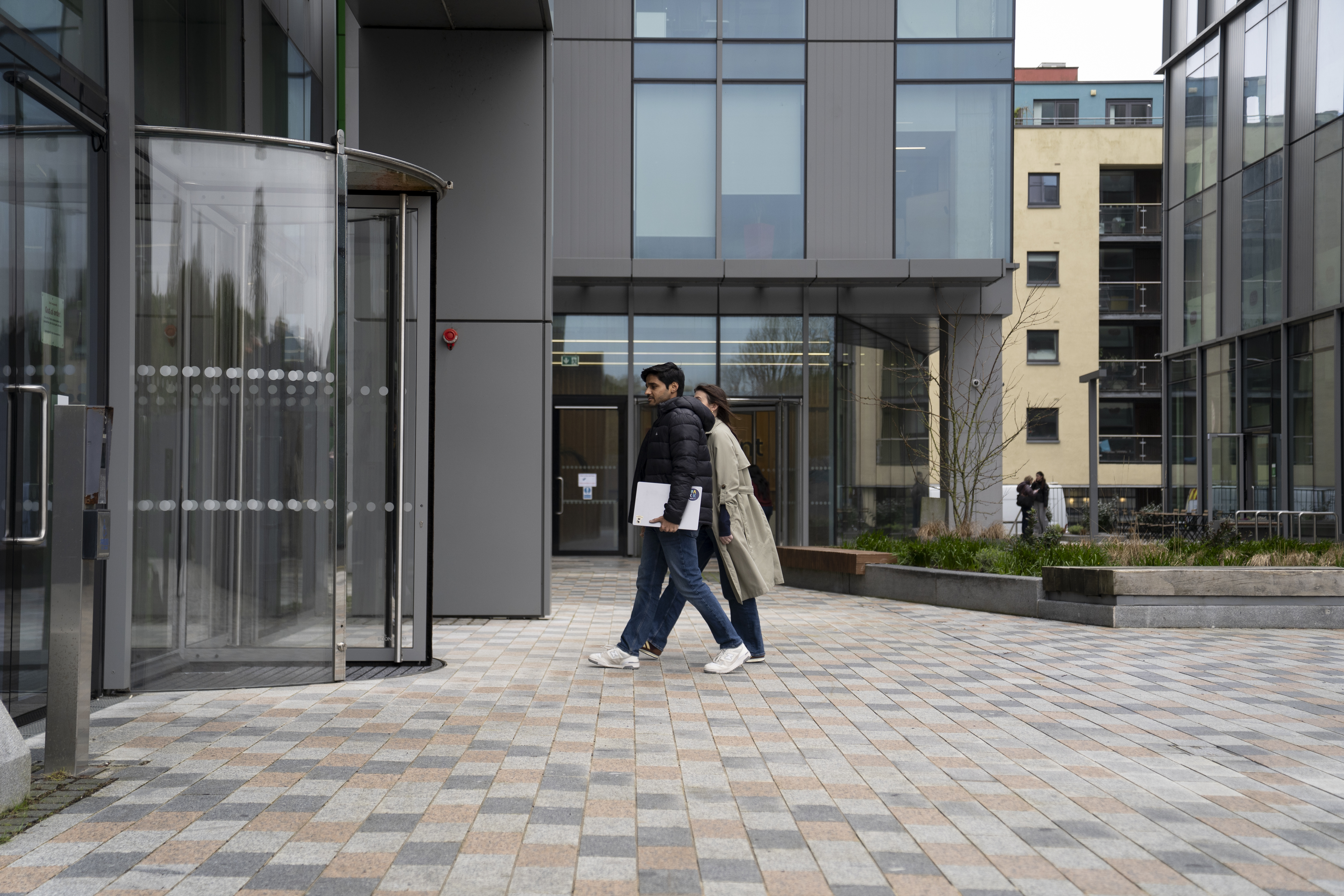 Employees walking outside the Liberty IT Galway office building.